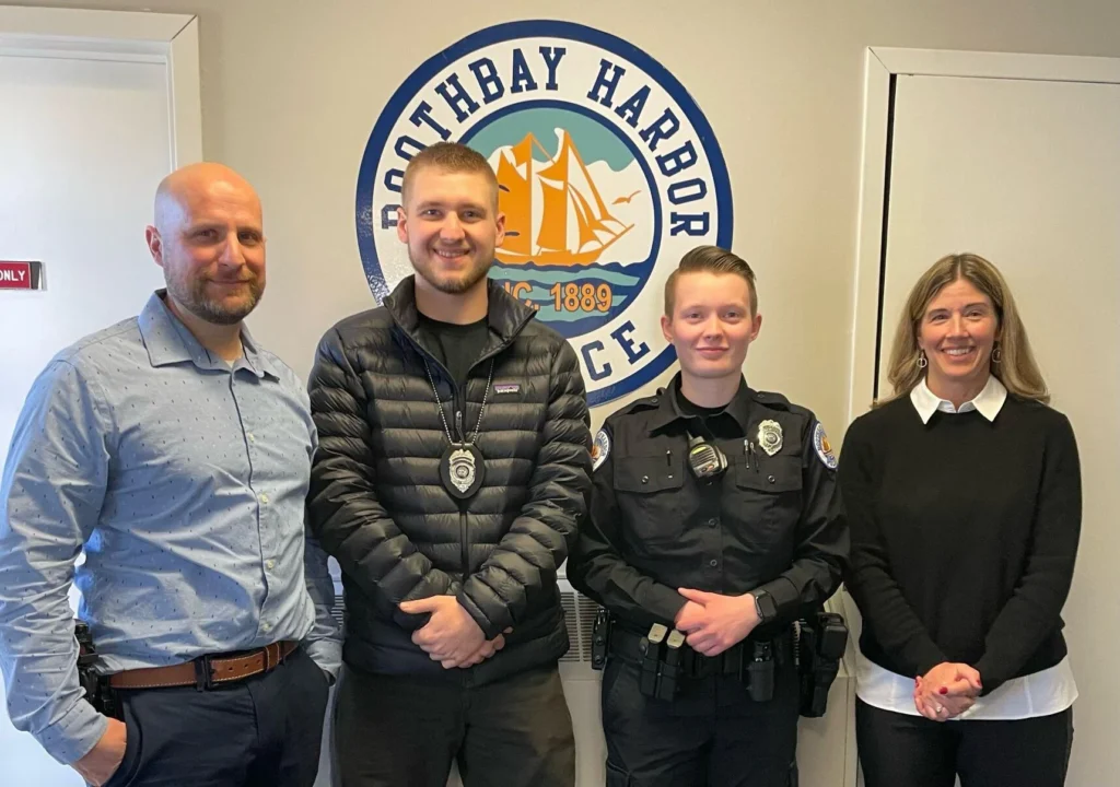 Legal Advocacy Director Susanna Norwood with Boothbay Harbor police officers after a recent training.