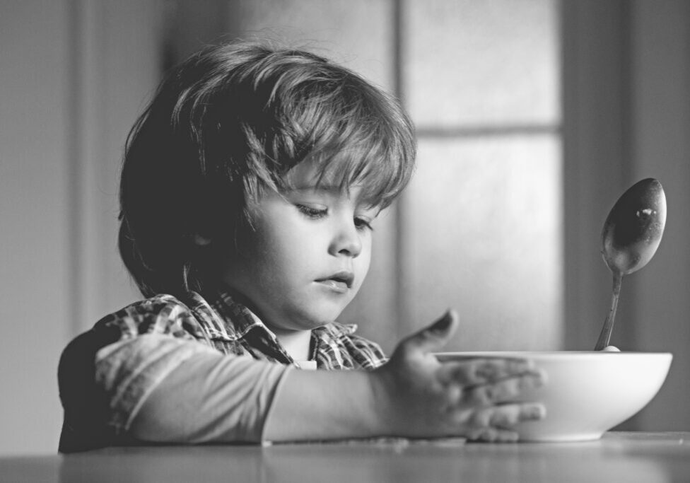 DV and Food Insecurity.jpeg Child holding a bowl of food.