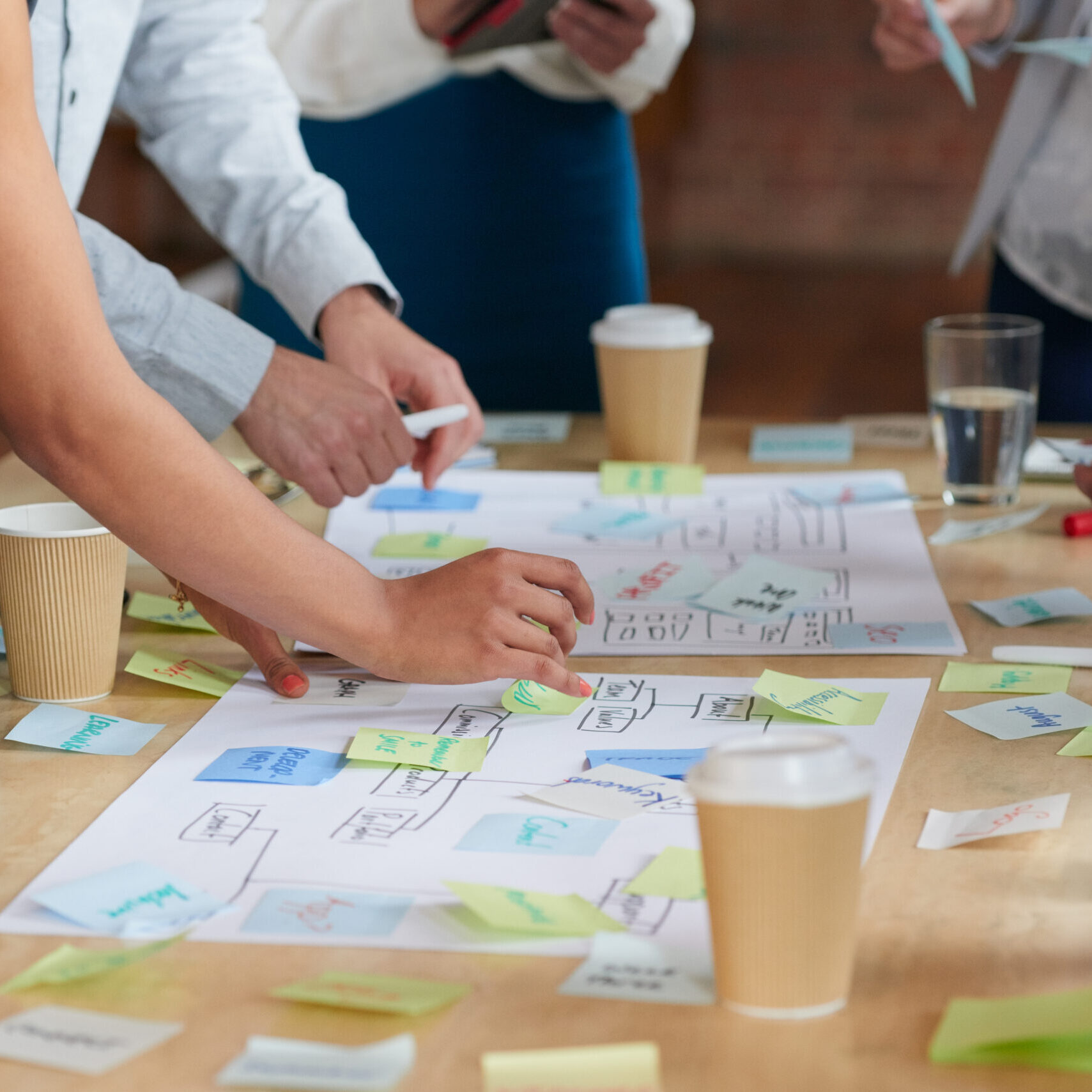Brainstorming,Session,With,Post,It,Notes,On,Desk Brainstorming,Session,With,Post,It,Notes,On,Desk